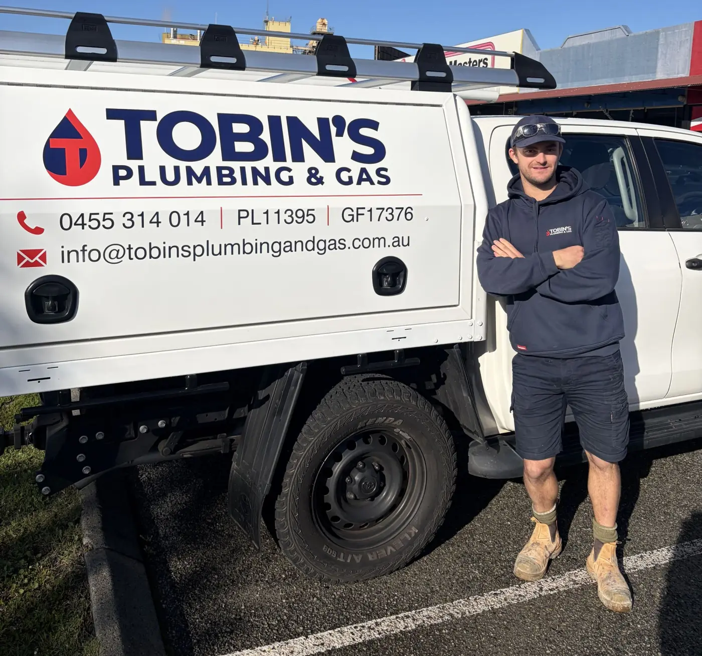 Remy Tobin standing beside the Tobin's Plumbing & Gas ute