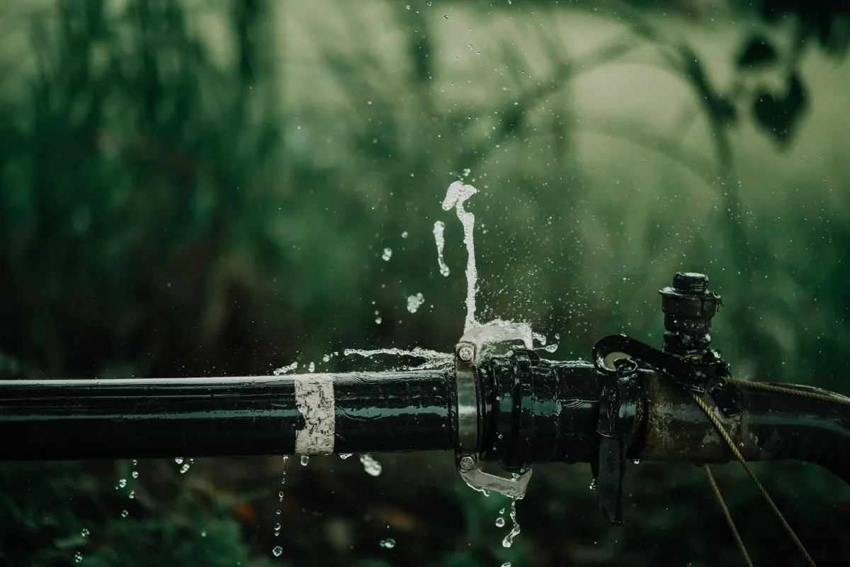 Water spraying from a burst pipe